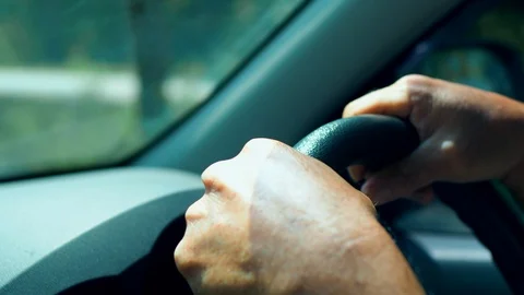 Close up shot of hand controlling car wheel in 4K Video stock 109081603