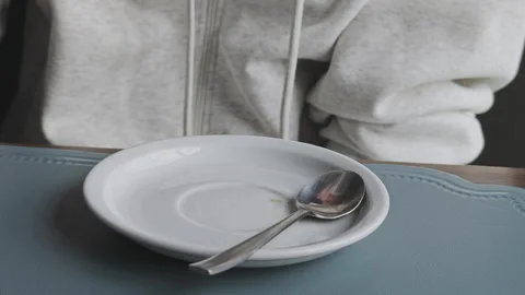 Close up shot of a hand grasping a white ceramic mug filled with steaming 스톡 동영상 347465885