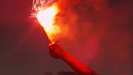 Close-Up Shot Of Hand Holding Firing Up Red Signal Flare At Evening. Stock Footage