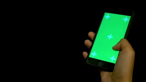 Close Up Shot of Hand of Man Holding his Smartphone with Green Screen click 스톡 동영상 336585718