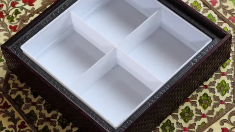 Close shot of a hand opening an empty dry fruits box Stock Footage 147072542