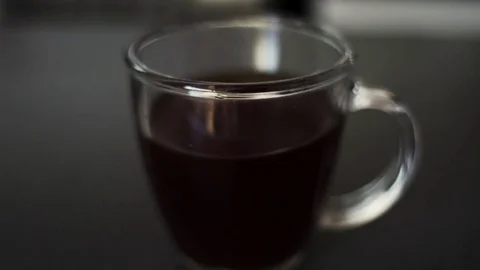 Close shot of hand pickng and leaving cup of coffee Stock Footage 82442052