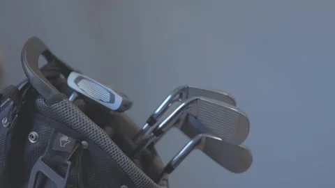 Close-up shot of a hand removing a 5 iron from a golf bag to hit a shot Stock Footage 312157319