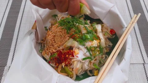Close up shot of Hand squeezing a slice of lime. Hand Squeezing a Piece of Fresh Stock-Footage 336588858