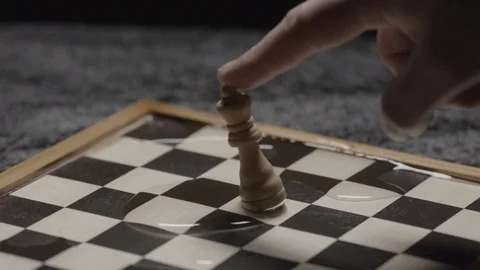 Close shot on a hand taking down the queen on a chessboard Slow motion at 200Fps 스톡 동영상 103547131