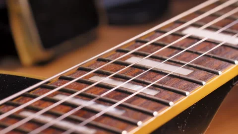 Close up shot the hand using microfiber fabric to clean the fret board Stock Footage 320095429