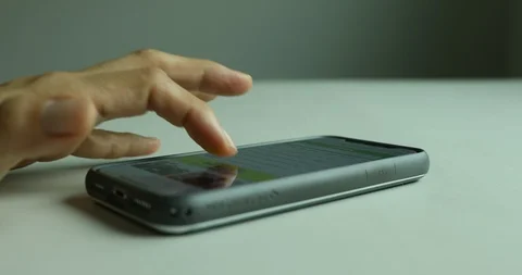 Close up shot of hand using smartphone on table Stock Footage 112314267