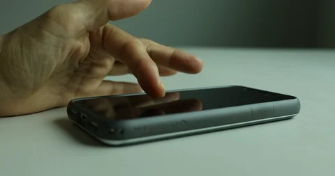 Close up shot of hand using smartphone on table Video stock 112314301