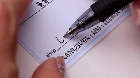 Close-up Shot Of A Hand Writing A Check Vídeo Stock 211476027