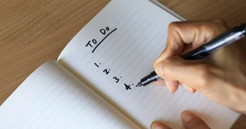 Close up shot of hand writing "to do list" on notepad Stock Footage 81313853