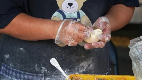 Close-up shot of a handmade, authentic Xian Bing meat pie, a stall vendor Stock Footage 276725429