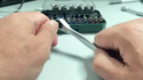 A close-up shot of hands assembling a screwdriver by inserting a magnetic s.. Stock Footage 323216148