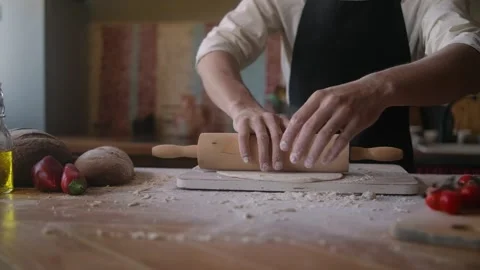 Close up Shot Of Hands Of Baker Rolls Dough In Flour On Wooden Board On Table Stock Footage 260900268