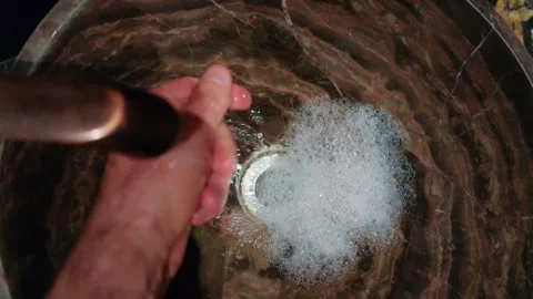 Close up shot of hands being washed with soapy water under running tap in m.. Stock Footage 339755292