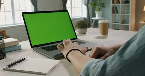 Close up shot of hands of freelancer working with chroma key green screen laptop Stock Footage