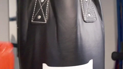 Up close shot of hands hitting a punching bag Portland OR USA June 20th 2025 Stock-Footage 311678743