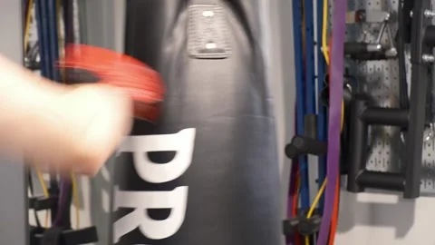 Up close shot of hands hitting a punching bag Portland OR USA June 20th 2025 Stock-Footage 311678758