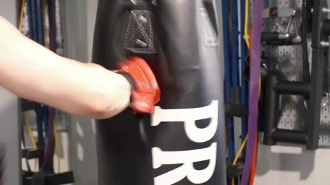 Up close shot of hands hitting a punching bag Portland OR USA June 20th 2025 Stock-Footage 311678762