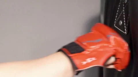 Up close shot of hands hitting a punching bag Portland OR USA June 20th 2025 Stock-Footage 311678764
