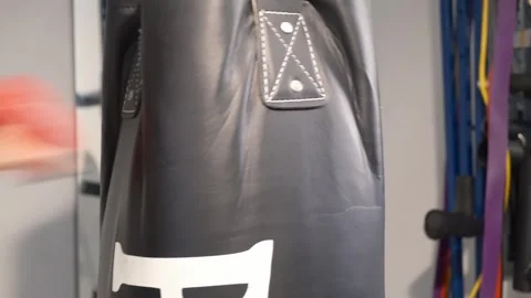 Up close shot of hands hitting a punching bag Portland OR USA June 20th 2025 Stock-Footage 311678769