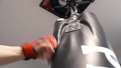Up close shot of hands hitting a punching bag Portland OR USA June 20th 2025 Stock-Footage 311678772
