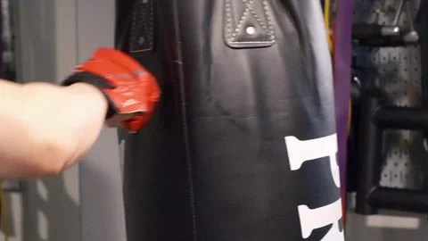 Up close shot of hands hitting a punching bag Portland OR USA June 20th 2025 Stock-Footage 311678775