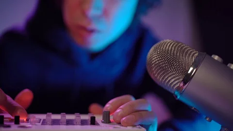 Close up shot of hand's man DJ playing music and voice bit at home recording Stock Footage 128743791