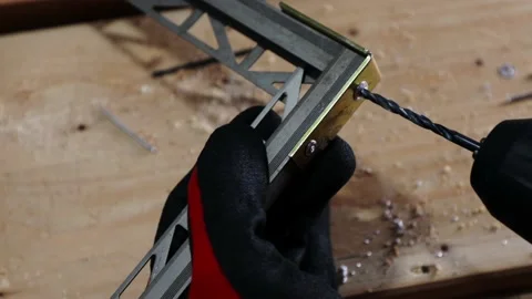 Close up shot on hands of man removing rivets from aluminium profiles. Stock Footage 140724572