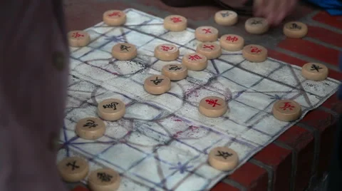 Close up shot of hands playing board game in park 库存影片 59305007