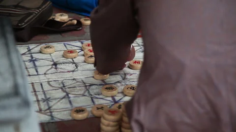 Close up shot of hands playing board game in park Stock Footage 62533300