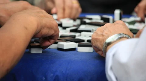 Close up shot of hands playing mah jong at People's square park in Shanghai Stock Footage 56801593