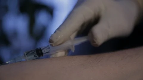 Close-up shot. Hands in protective gloves doing an injection Stock Footage 101148224