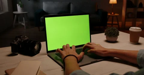 Close up shot of hands of a remote worker working on laptop computer with chroma Stock Footage 133127597