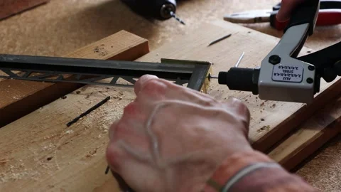 Close up shot on hands with rivet gun. Stock Footage 140724433