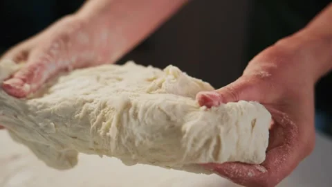 Close-up shot of hands shaping dough Video stock 336084169