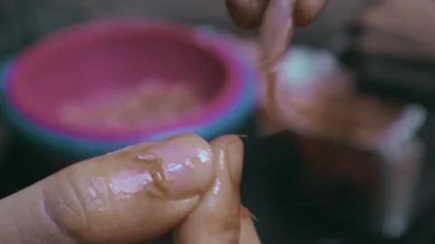 A close-up shot of hands skillfully peeling and preparing fresh shrimp. Stock Footage 299577491