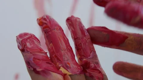 Close-up shot: hands stained with paint. A talented artist, a woman, draws a Stock Footage 247128778