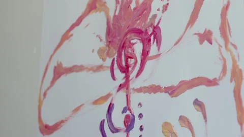 Close-up shot: hands stained with paint. A talented artist, a woman, draws a Stock Footage 247128866