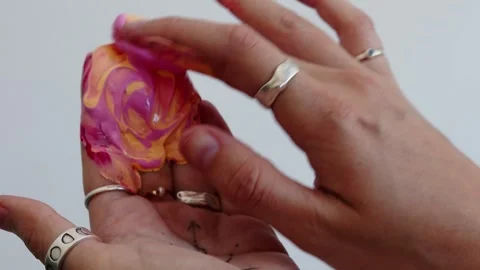 Close-up shot: hands stained with paint. A talented artist, a woman, draws a Stock Footage 247129034
