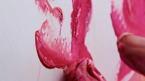 Close-up shot: hands stained with paint. A talented artist, a woman, draws a Stock Footage 247129553