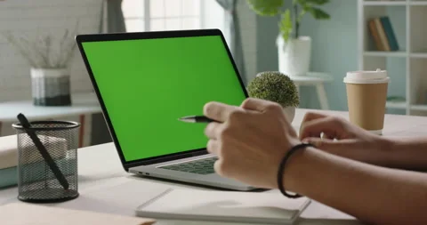 Close up shot of hands of student working with chroma key green screen laptop Stock Footage 136034802