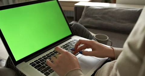 Close up shot of hands of student working with chroma key green screen laptop Stock Footage 145717992