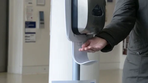Close shot, hands taking gel sanitizer from dispenser Stock Footage 126299273