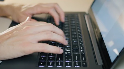 Close up shot of hands typing on computer keyboard, business man working on Stock Footage 120300243