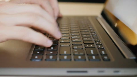Close up shot of hands typing on computer keyboard, business man working on Stock Footage 120300280