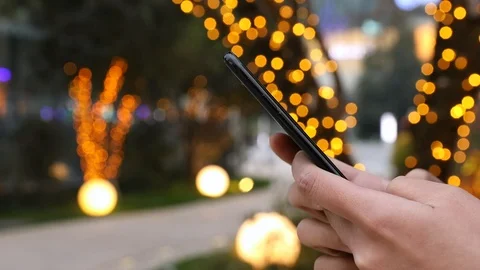 Close-up shot of hands using mobile phone 스톡 동영상 104399893