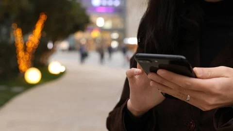 Close-up shot of hands using mobile phone 스톡 동영상 104399899