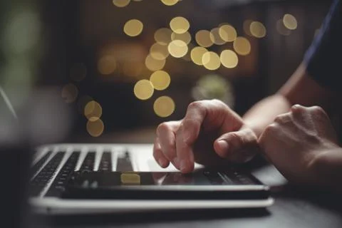 Close up shot of hands using smart phone typing message for searching with la Stock Photos