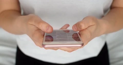 Close-up shot of hands using smartphone surfing in internet. Scrolling news feed Stock Footage 170532003