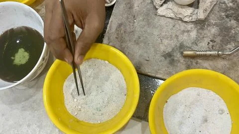 Close up shot of hands using tweezers to mix ingredients Stock Photos